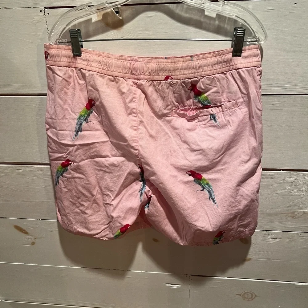 Modern Amusement men’s pink parrot print swim trunks size medium, GUC, lined.